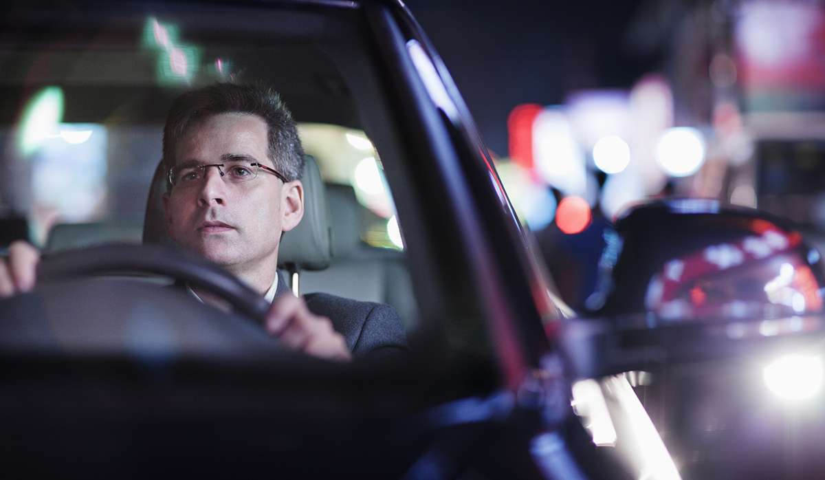 illustrating how aging impacts night driving, focusing on reduced night vision and safety tips for drivers over 50.
