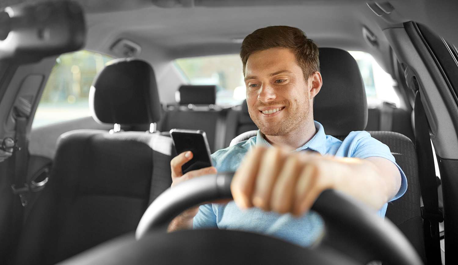 Image explaining the rise in distracted driving accidents, emphasizing smartphone and in-car tech distractions and their impact on road safety.